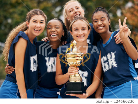 Women, team and winner trophy in fitness game, training match or exercise competition on netball sports field. Portrait, happy smile or sports award for teamwork diversity or friends workout success 124560230