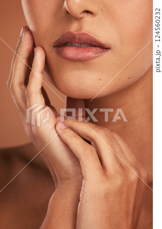 Beauty, skincare and lips, portrait of woman in studio, luxury spa treatment for healthy and glowing skin, cropped. Health, wellness and model girl with beautiful face and mouth on brown background. 124560232