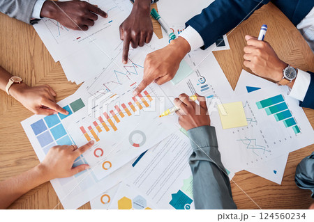 Meeting, paperwork and business people planning a project together in a corporate modern office. Documents, diversity and hands of a team working on a strategy with statistics, graphs and charts data 124560234