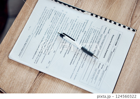 Divorce, legal and paper with pen for couple signature agreement, contract and paperwork on table in lawyer office. Family law, government and ethics of marriage document by a professional advocate 124560322