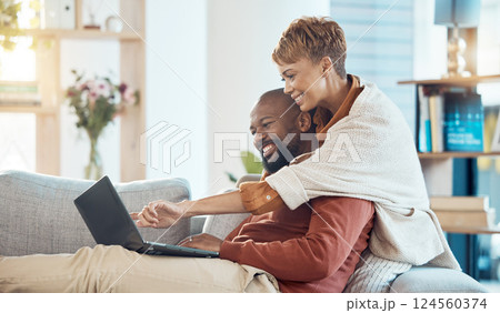 Pointing, laptop or bonding mature couple on sofa in house or home living room on real estate, property or apartment internet search. Smile, happy or hug black woman and man with mortgage technology Pointing, laptop or bonding mature couple on sofa in house or home living room on real estate, property or apartment internet search. Smile, happy or hug black woman and man with mortgage technology 124560374