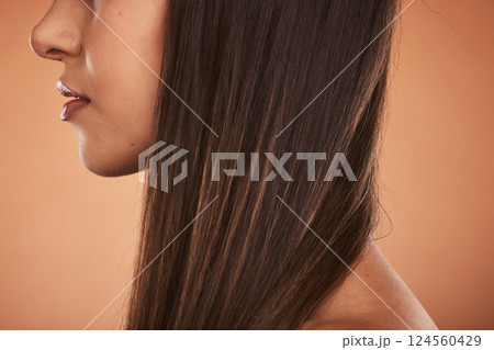 Hair care, growth and woman with beauty, wellness and health against a brown studio background. Brunette, relax and calm lifestyle model for luxury, cosmetic and young hair with side profile Hair care, growth and woman with beauty, wellness and health against a brown studio background. Brunette, relax and calm lifestyle model for luxury, cosmetic and young hair with side profile 124560429