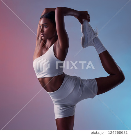 Bow balance exercise of woman stretching legs for fitness, yoga training workout or healthy lifestyle on studio gradient background. Young, strong and focus indian girl, athlete and pilates challenge 124560681