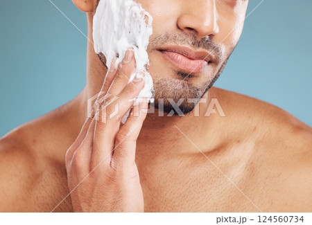 Shaving cream, skincare and skin grooming of a black man busy with beauty and facial routine. Face health, wellness and cosmetic lotion treatment of a person with beard moisturizer and shave product 124560734