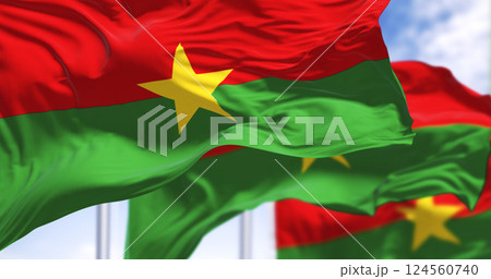 Burkina Faso national flags waving with green and red colors in the sky 124560740