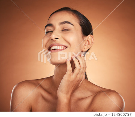 Woman, beauty and smile for skincare, cosmetics or makeup of model in happiness against a studio background. Happy female smiling for moisturizer, facial or care in soft perfect skin treatment Woman, beauty and smile for skincare, cosmetics or makeup of model in happiness against a studio background. Happy female smiling for moisturizer, facial or care in soft perfect skin treatment 124560757