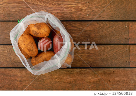 Various varieties of potatoes in fabric packaging. Healthy natural products in an eco bag to boost immunity, healthy lifestyle concept, zero waste. Banner for the store. No plastic. Selective focus 124560818