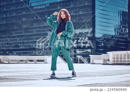Fashion, style and woman on rooftop in city with stylish, trendy and modern outfit. Summer, freedom and carefree girl in town with creative, cool and designer clothes on weekend by urban building 124560940