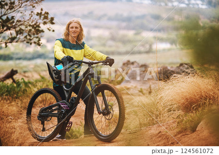 Cycling, sports and bike rider man on an outdoor, nature and mountain trail ready for a race. Portrait of a person with a bicycle outdoors for training, fitness and cyclist workout on a dirt trail Cycling, sports and bike rider man on an outdoor, nature and mountain trail ready for a race. Portrait of a person with a bicycle outdoors for training, fitness and cyclist workout on a dirt trail 124561072