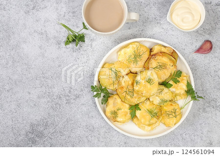 Fried veggie zucchini in batter with garlic sauce and spices on a concrete table,organic natural grilled zucchini,healthy breakfast with ingredients,weight loss and slimming concept,selective focus 124561094