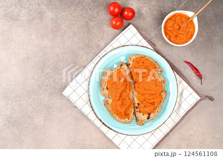 Sandwich with grain bread and pumpkin caviar on concrete background, healthy breakfast with ingredients, healthy eating concept, space for text, selective focus 124561108