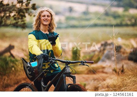 Sports, bike and cyclist man hand sign in nature on a park trail with a smile. Portrait of an adventure athlete on a bicycle ready for cycling, sport and fitness in a mountain park road in nature 124561161