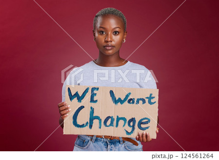Black woman, protest and billboard message for change, text or voice against mockup studio background. Portrait of African American female activist with banner, poster or sign for empowerment or vote 124561264