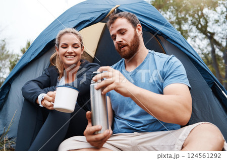 Camping, tent and couple with coffee in morning, enjoying being outdoors, nature and vacation. Freedom, travel and man with flask pouring hot beverage for woman on camp holiday, weekend and adventure 124561292