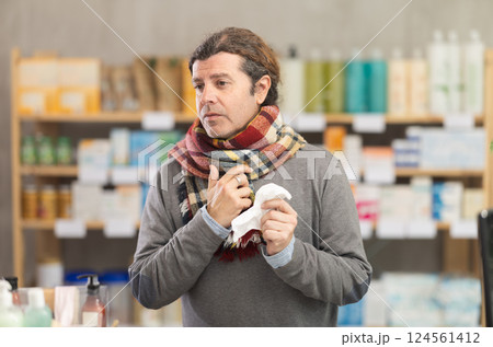 Man with family therapists prescription visits pharmacy and suffers from sore throat 124561412