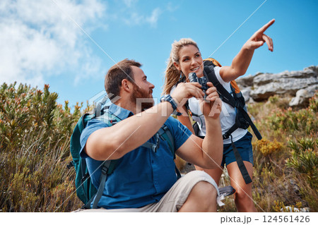 Hiking, couple and in nature to relax, talking and enjoy the outdoor view for fresh air. Health, man and woman point have speaking with tourist, mountain range or vacation with binocular and wellness 124561426