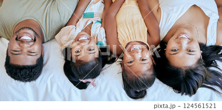 Family, happiness and bedroom playing of mother, father and girl face at home. Portrait of happy parents and children smile in a parent of kid room feeling love, fun and care in a house on a morning 124561521