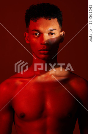 Beauty, body and aesthetic of young man in studio with neon red light for skincare, exercise or fitness background. Portrait of male commitment to exercise, health and body wellness for inspiration 124561543