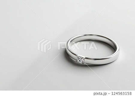 Elegant silver ring with subtle design on pristine white background 124563158