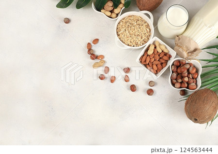 Assorted vegan lactose free milk, coconut, nut, oat, almond, milk replacer, healthy breakfast with ingredients, natural nutrition concept, maintaining a healthy intestinal microflora, diet food, Assorted vegan lactose free milk, coconut, nut, oat, almond, milk replacer, healthy breakfast with ingredients, natural nutrition concept, maintaining a healthy intestinal microflora, diet food, 124563444
