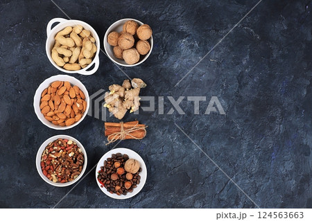 Assortment of different nuts, the concept of healthy natural food, almonds, pecans, pistachios, cashews, walnuts and pine nuts, high-calorie food with vegetable protein and vitamins, the basis of diet Assortment of different nuts, the concept of healthy natural food, almonds, pecans, pistachios, cashews, walnuts and pine nuts, high-calorie food with vegetable protein and vitamins, the basis of diet 124563663