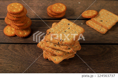 Dry french cracker with sesame seeds on wooden background.Homemade chocolate chip cookies with gluten free nuts,modern bakery concept. Healthy breakfast with ingredients, top view, selective focus, 124563737