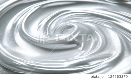 Swirling silver liquid on a smooth surface creating an abstract pattern 124563870