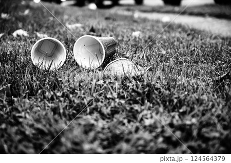 Crushed and discarded red plastic cups after a college party 124564379