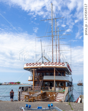 Boats and boats in the port of Batumi. Ships in the harbor. Moored to the shore of the court.  Transport for recreation on the water 124564517