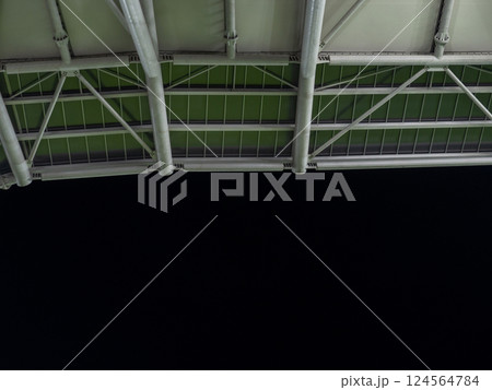 Arch of the football stadium. Football match lighting. Part of a sports facility. Sports complex engineering. Design. 124564784
