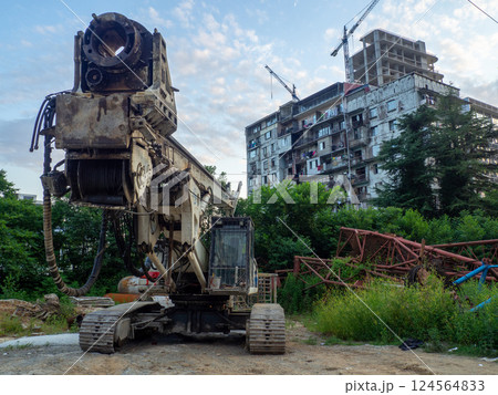 Construction equipment. Heavy machines for work. Driving piles. High-rise buildings. Not in working order. Construction industry. Construction equipment. Heavy machines for work. Driving piles. High-rise buildings. Not in working order. Construction industry. 124564833