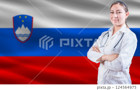 Female Doctor on Slovenian Flag. Doctor with Crossed Arms on Slovenian Flag. Slovenia Health and Care Concept Female Doctor on Slovenian Flag. Doctor with Crossed Arms on Slovenian Flag. Slovenia Health and Care Concept 124564975