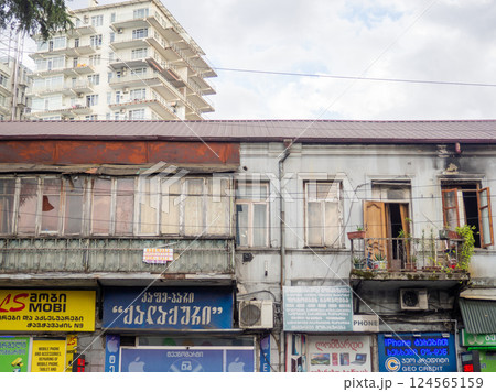 Old Asian building facade. Tourism in the old city. Advertisement and old house. Asia old city architecture Old Asian building facade. Tourism in the old city. Advertisement and old house. Asia old city architecture 124565159
