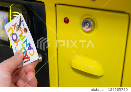 Sioux Falls, South Dakota, USA - 12.10.2023: All you can play card used for games at Chuck E. Cheese 124565720