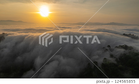 Aerial view of An early morning sunrise over Misty Mountain Valley 124565855
