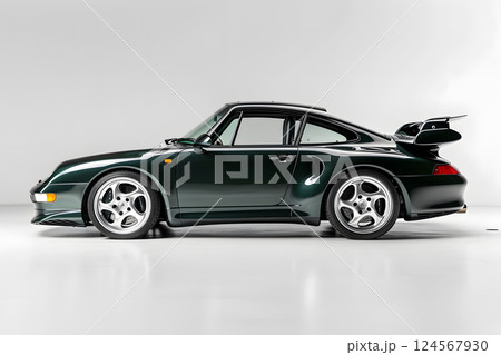 Green sports car with spoiler for aerodynamics and sleek appearance 124567930