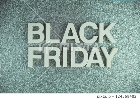 Black Friday alphabet letters on silver glitter background 124569482