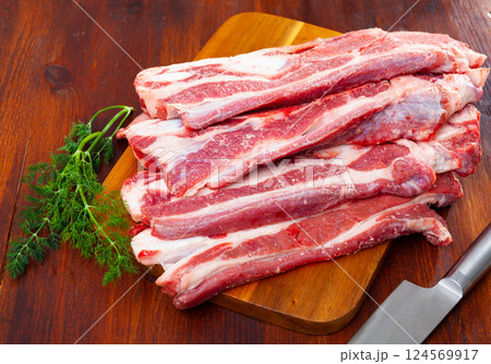 Raw beef steak with dill served to table Raw beef steak with dill served to table 124569917