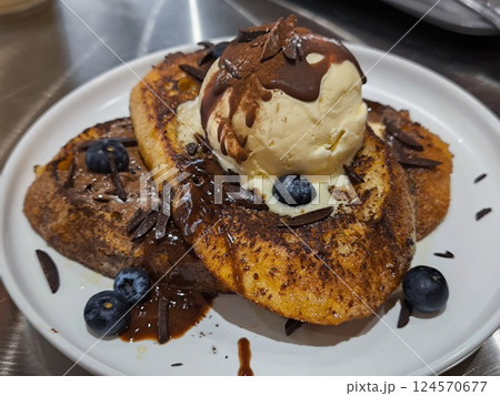 Delicious French Toast with Ice Cream and Chocolate Sauce Delicious French Toast with Ice Cream and Chocolate Sauce 124570677