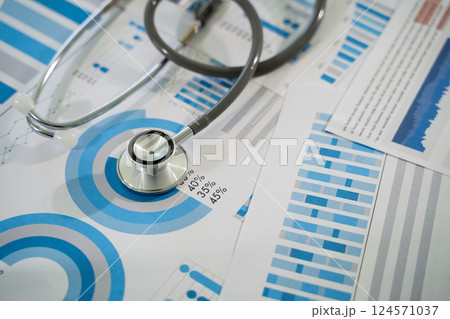 Medical insurance business doctor analyzing medical report Health insurance business virtual graph data and growth 124571037