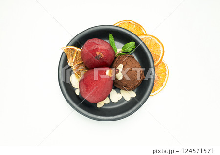 Ice cream and pears in wine on plate and orange slices on white background, top view Ice cream and pears in wine on plate and orange slices on white background, top view 124571571