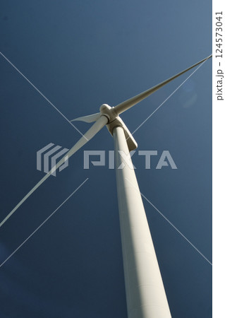 Wind turbine with blue sky at background Wind turbine with blue sky at background 124573041