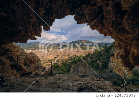 View of the exit from the cave in the mountains View of the exit from the cave in the mountains 124573078