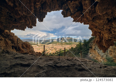 View of the exit from the cave in the mountains View of the exit from the cave in the mountains 124573081