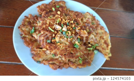 Authentic Thai Omelette. Street Food Classic. 124574103