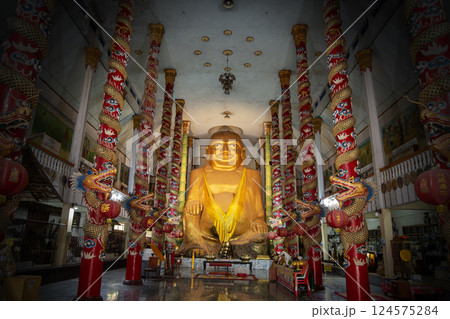 A large golden Buddha statue in Chinese style is enshrined in temple. A large golden Buddha statue in Chinese style is enshrined in temple. 124575284