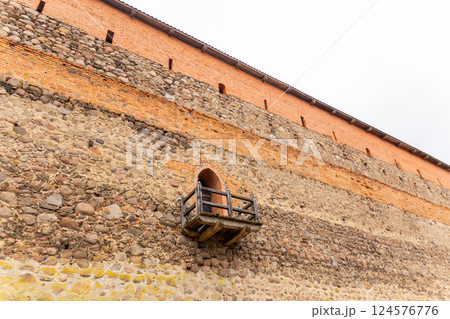 brick wall of an old castle with toilet room 124576776
