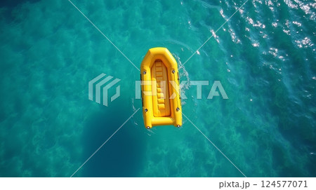 Yellow inflatable boat floating on turquoise water, top view. Marine rescue equipment, summer adventure, travel and outdoor recreation concept with copy space 124577071