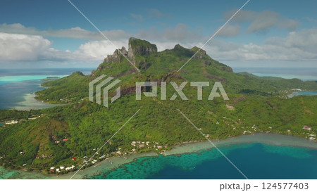 Drone panorama breathtaking aerial view of mount Otemanu towering over Bora Bora lush greenery, turquoise lagoon, and vibrant coral reefs in French Polynesia. Amazing tropical scenery exotic landscape 124577403
