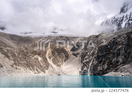 Laguna 69 with turquoise water and snowy mountains in Huaraz, Peru Laguna 69 with turquoise water and snowy mountains in Huaraz, Peru 124577476